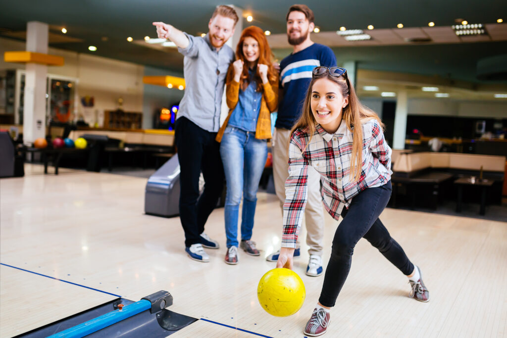 Competitve people enjoying bowling